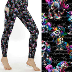 mock up of Undead Unicorns leggings. Zombie unicorns with a rainbow mane and horn, dressed in hip hop clothing. Black background with barbed wire.