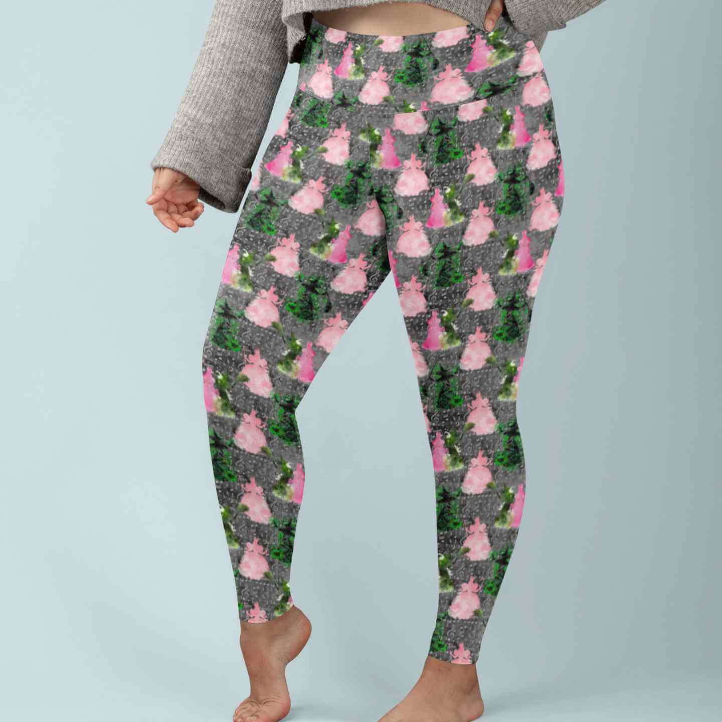 lady wearing high waisted leggings with Wicked the movie print by Nikki Whoops Boutique.