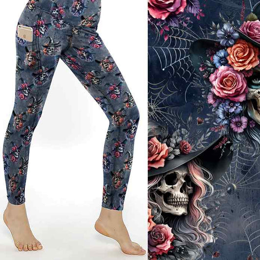 Leggings with witch skulls, roses, and cobwebs on a dark background; close-up of intricate floral and gothic details.